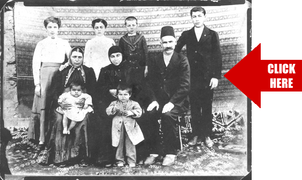 Historic group portrait of Flora's family, with adults and children standing and seated together. The printed Click Here arrow is part of the image; use the video player above to watch the interview.